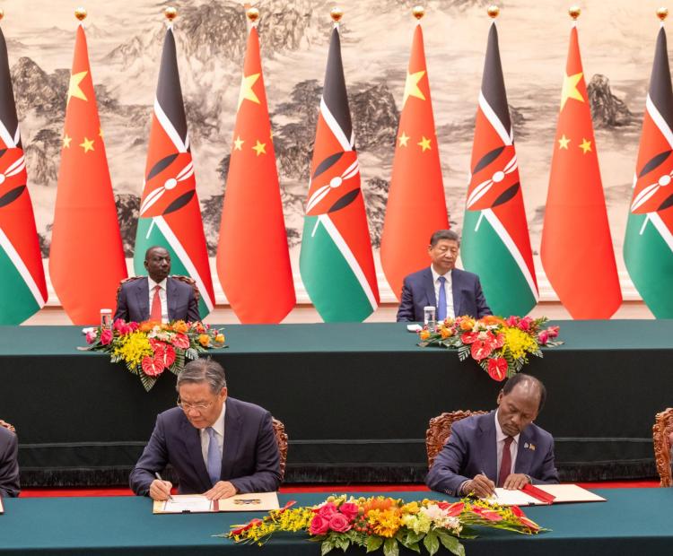 Kenya and China government officials signing documents on bilateral cooperation between the two countries in the presence of President William Ruto and his Chinese counterpart Xi Jinping in Beijing. Photo: PCS.
