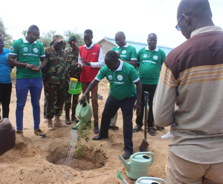 Turkana residents plant trees during the world  environment day at Muli Christian Primary School in  Lokaparaparae village, Turkana Central. 