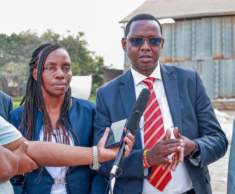 Officials from Ministry of Agriculture inside one of the rice stores in Mwea, Kirinyaga County.