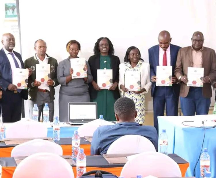 Lead coordinators of Trans Nzoia County Development projects display copies of guidelines to help in formation of Project Management Committees (PCMs).