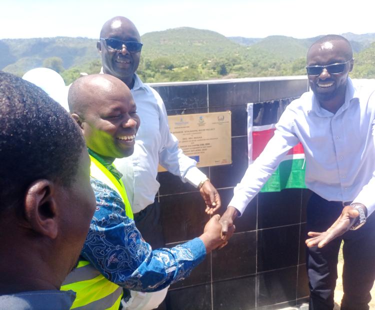 Water CS Eric Mugaa(R) commissioning the Mtembur-Kitelakapel water project in West Pokot  county.