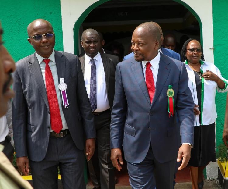 CS Mutahi Kagwe (right) is taken round the Nakuru Show by Nakuru Deputy Governor Dr David Kones (left)