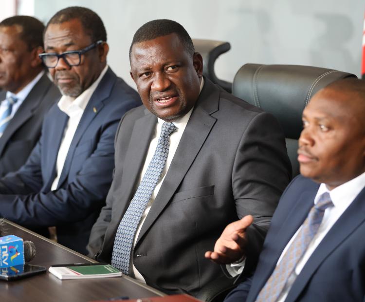 (From left) CAF Secretary General Veron Mosengo-Omba, Cabinet Secretary for Youth Affairs, Creative Economy and Sports, Salim Mvurya and Principal Secretary, State Department for Sports, Elijah Mwangi, during a CHAN 2024 Championship press briefing at the Talanta Plaza.