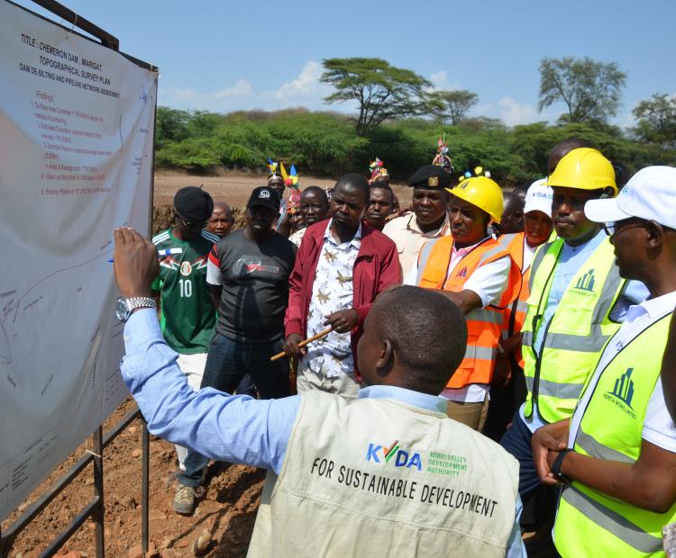 An official from KVDA explaining the survey plan for rehabilitation works of Chemeron Dam in Marigat Sub County. PHOTO: BENSON KELIO