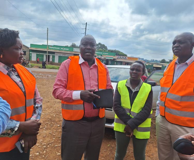 Uasin Gishu Chief Officer for Housing and Urban Development, Mary Kerich (left), Chief Officer for Lands, Julius Koech (center), and County Executive Committee Member (CECM) for Lands, Physical Planning, Housing and Community Development, Edward Sawe (right), during an inspection tour in Eldoret, Uasin Gishu County.