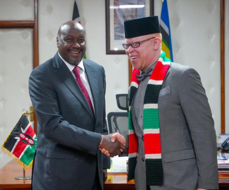 Deputy Head of the Public Service, Amos Gathecha and Government Spokesperson, Dr. Isaac Mwaura, engage during a meeting on government communication at Harambee House