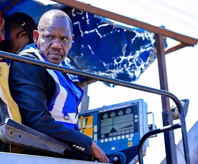 Uasin Gishu County Governor Dr. Jonathan Bii Chelilim atop a bitumen paver machine during the inspection of the ongoing 4-kilometer Maili Nne Road upgrade in Turbo Sub-County, Uasin Gishu County.