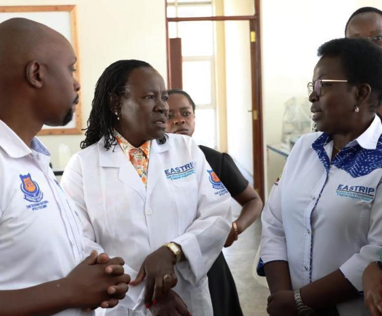State Department for Technical Vocational Education and Training (TVET) Principal Secretary (PS) Dr. Esther Thaara Muoria (centre) having a word with some of the team members when she led the East Africa Skills for Transformation and Regional Integration Project (EASTRIP) on an inspection tour of the Sh1.2 billion textile technology factory, which has been under construction at the Kisumu National Polytechnic project on Monday.