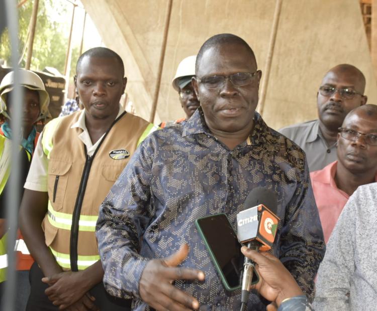 North Eastern Regional Commissioner John Otieno addressing the press after touring the ongoing construction of the Sh1.7 billion Tana bridge.