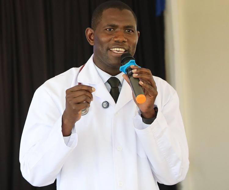 Medical Services PS Dr. Ouma Oluga speaking during the 2nd Artificial Intelligence in Health Workshop held at Kenyatta National Hospital to mark World Cancer Day.