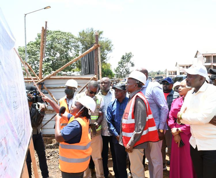 Deputy President Prof Kithure Kindiki (in a reflector jacket) views the architectural design of the Sh350 million Field Marshal Muthoni Kirima Modern Municipal Market in Nyeri.